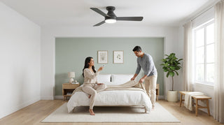 Bright modern bedroom with a dark-blade flush-mount LED ceiling fan — couple toggles seasonal direction with the remote