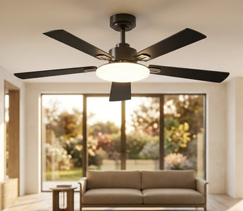 Black flush-mount ceiling fan installed in a sunlit modern living room, showing a clean home ceiling fan installation setup