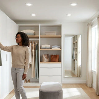 Bright walk-in closet lit by slim canless LED recessed downlights — energy-efficient, neutral-white closet lighting