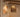 Gimbal recessed lights highlighting framed artwork in a warm loft gallery — directional trim accent lighting in use