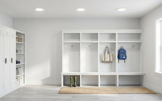 Bright American mudroom lit by slim canless LED recessed downlights — energy-efficient lighting for high-traffic entries