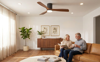Walnut wood blade ceiling fan + warm-white LED recessed downlights in a mid-century living room — layered ceiling lighting